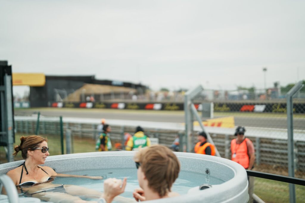 Commercial hot tub hire UK trackside at festival, HSG282 compliant spa for guests